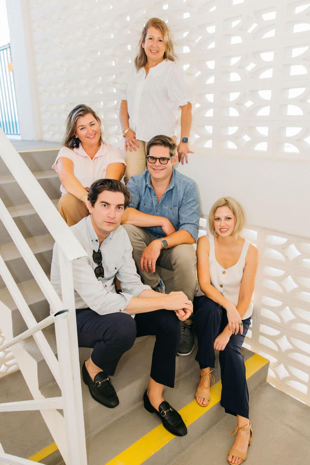 DMW Law Group three partners J. Cole Davis, Julia Maddalena, and C. Andrew Weddle, with paralegals Erica Citrigno and Margaret Clark